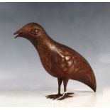 A 19th Century Persian iron and yellow metal wire inlaid bird figure.