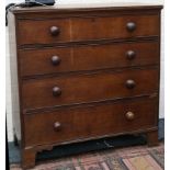 A 19th Century oak chest of drawers, bun handles, four graduating drawers with beading, bracket