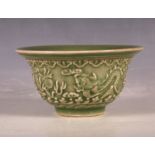 A Chinese celadon green rice bowl, decorated with two dragons chasing a flaming pearl, mark to base,