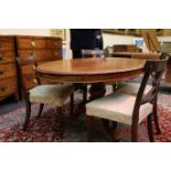 A 19th Century mahogany, oval tilt top table, raised on a turned pedestal on three down swept