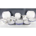 An Art Deco Shelly bone china tea service, to include ten cups, twelve saucers, twelve side