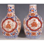 A pair of Imari ovoid 'bottle' form vase, 21cm H. (2)