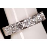 An 18ct white gold and diamond half eternity ring, 1.29ct total.