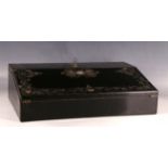 A Victorian black lacquered writing slope, inlaid with gilt scrolling and mother of pearl detailing,