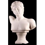 A white marble bust of Adonis, after the Antique, on a socle, 62cm H approx. (on socle).