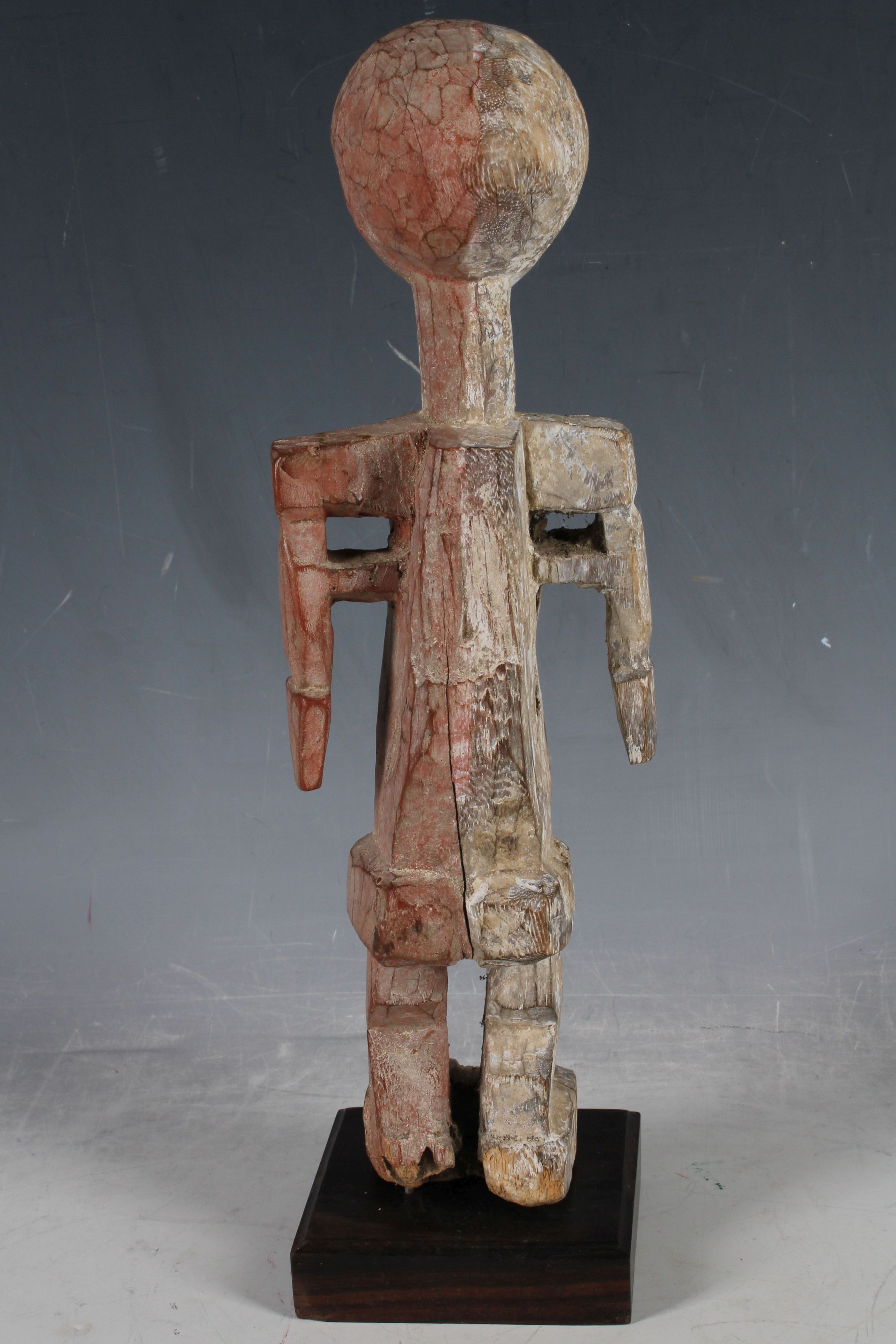 A carved African tribal figure, female fertility with black and red organic kaolin pigment, possibly - Image 2 of 2