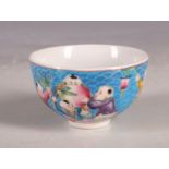 A Chinese small tea bowl, blue scale decoration with children, playing and celebrating giant