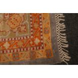 An antique Anatolian rug of carpet proportions, with central lozenges on a saffron field,