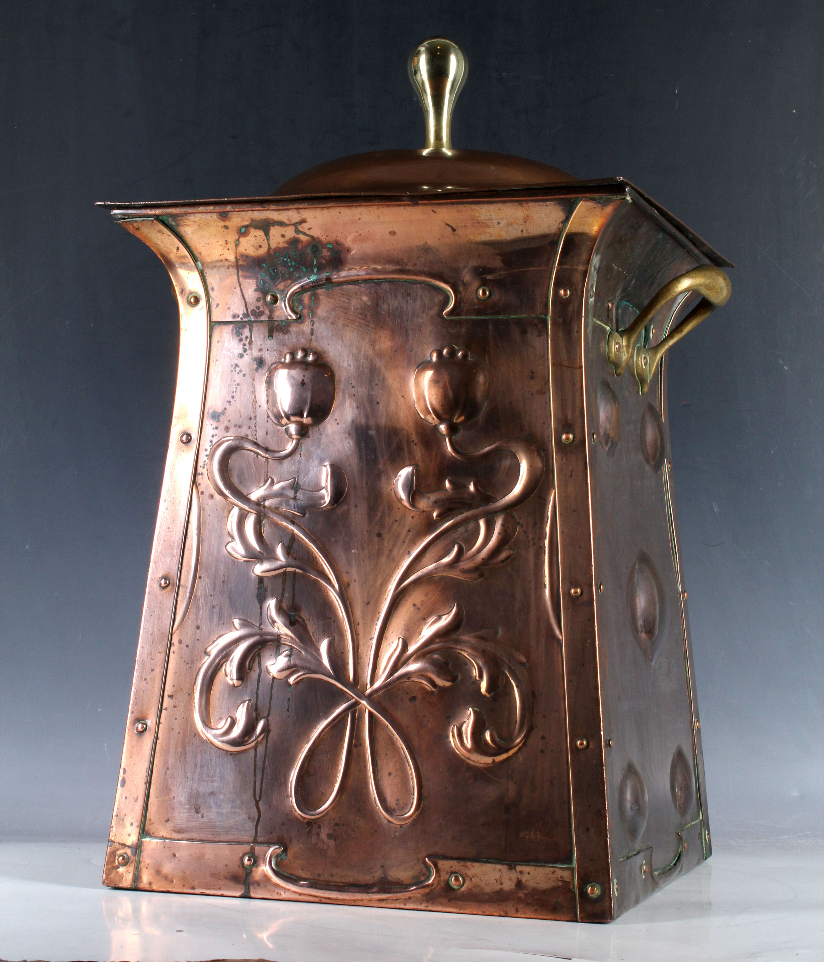 Scottish School, Arts & Crafts copper and brass log basket, embossed with McIntosh style flowering
