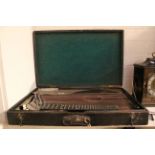 A cased rosewood and ebony Alpine Zither, in original felt lined wooden case.