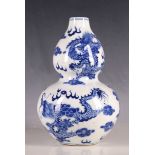 A Chinese blue and white double gourd vase, dragons chasing flaming pearl, six character marks to