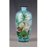 An early 20th Century Japanese export cloisonné small vase, applied with two storks on blue lustre