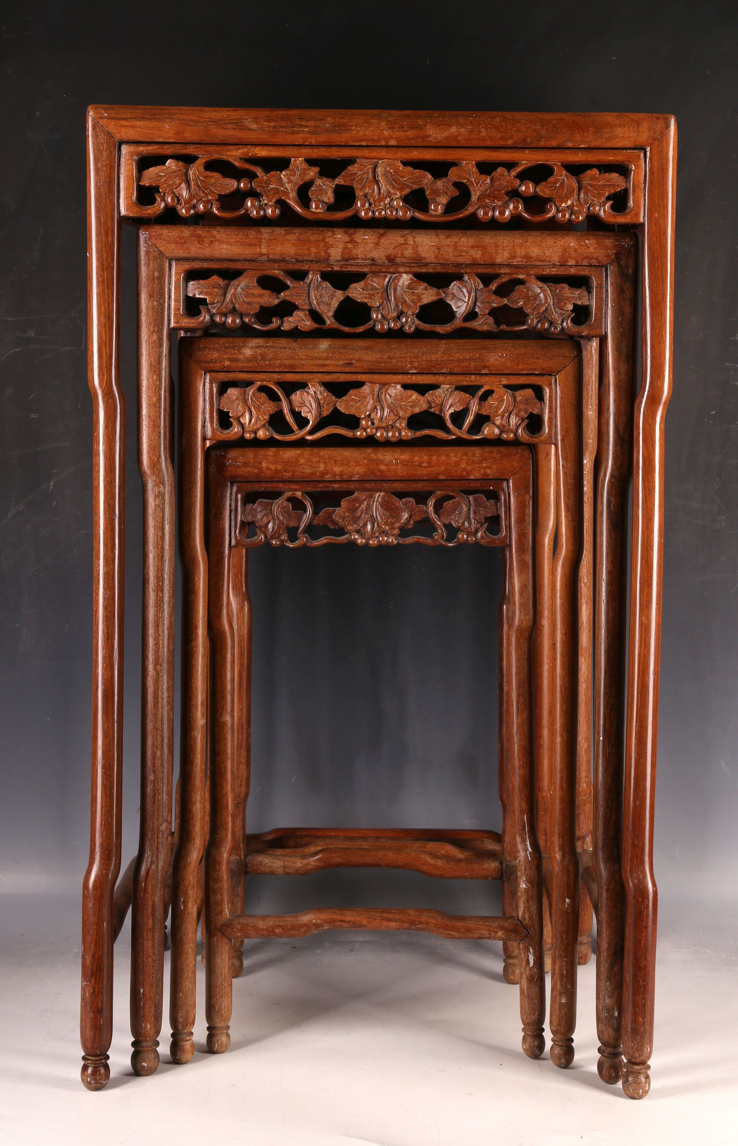 A nest of four Chinese hardwood tables, having carved aprons and inset tops. (4) - Image 2 of 3