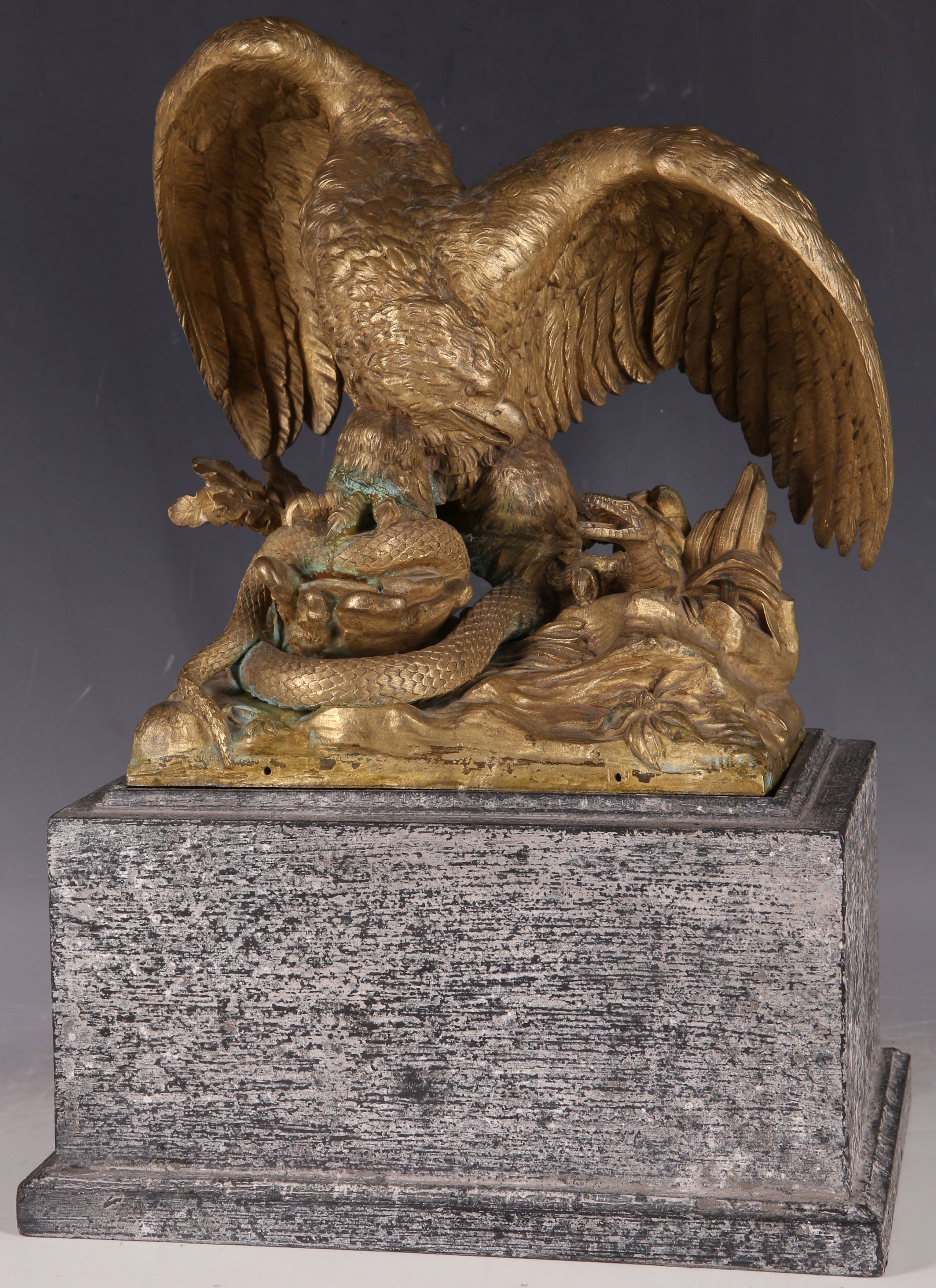 A dramatic 19th Century gilt bronze group of an eagle and serpent, the base stamped 3276, size