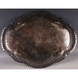 An antique Middle Eastern cartouche shaped tray with pierced rim.