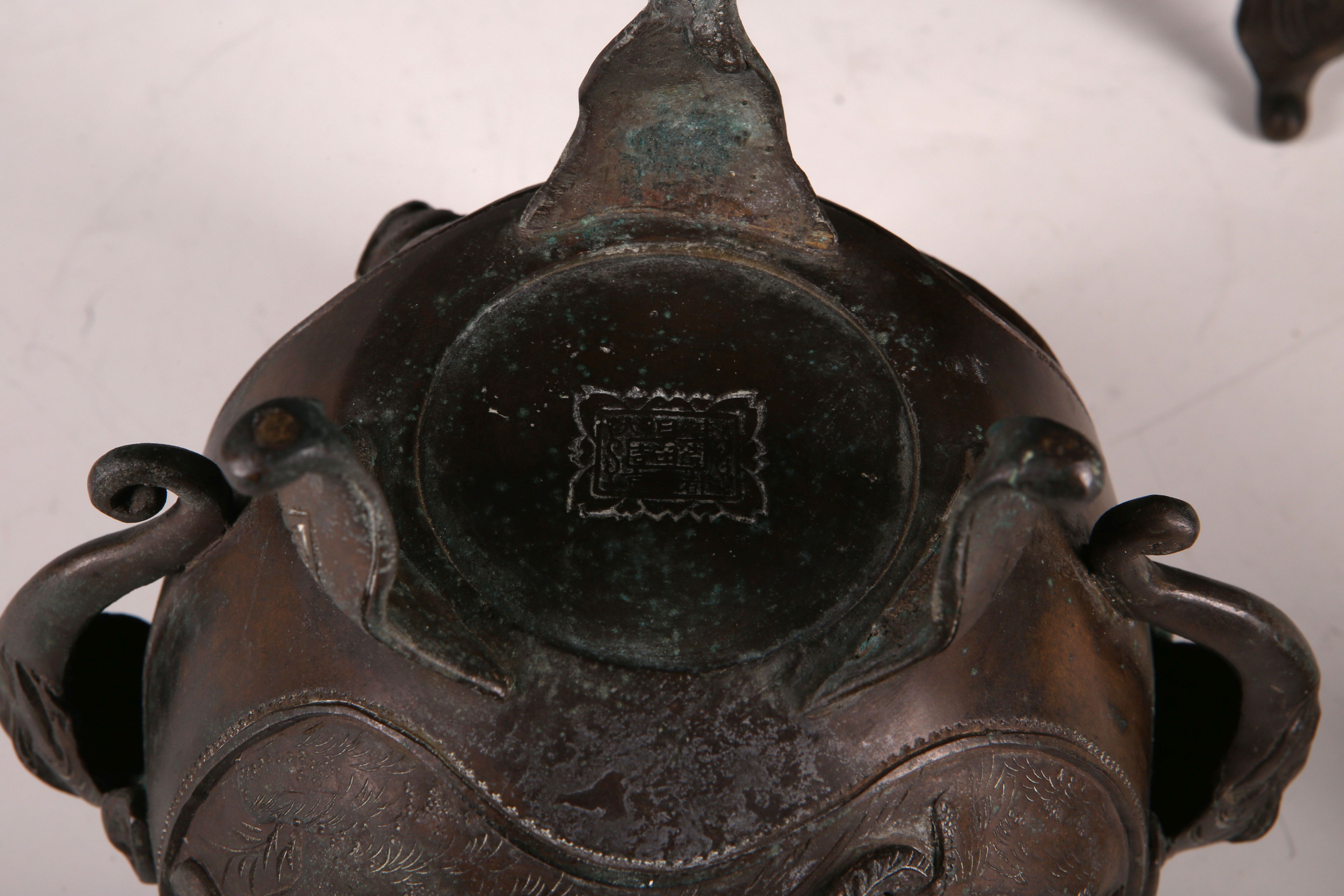 A pair of Japanese bronze incense burners, the body of each decorated with two panels with a pair of - Image 3 of 3