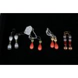 Four pairs of pendant earrings, including shell pearls and faux pearls. (4)