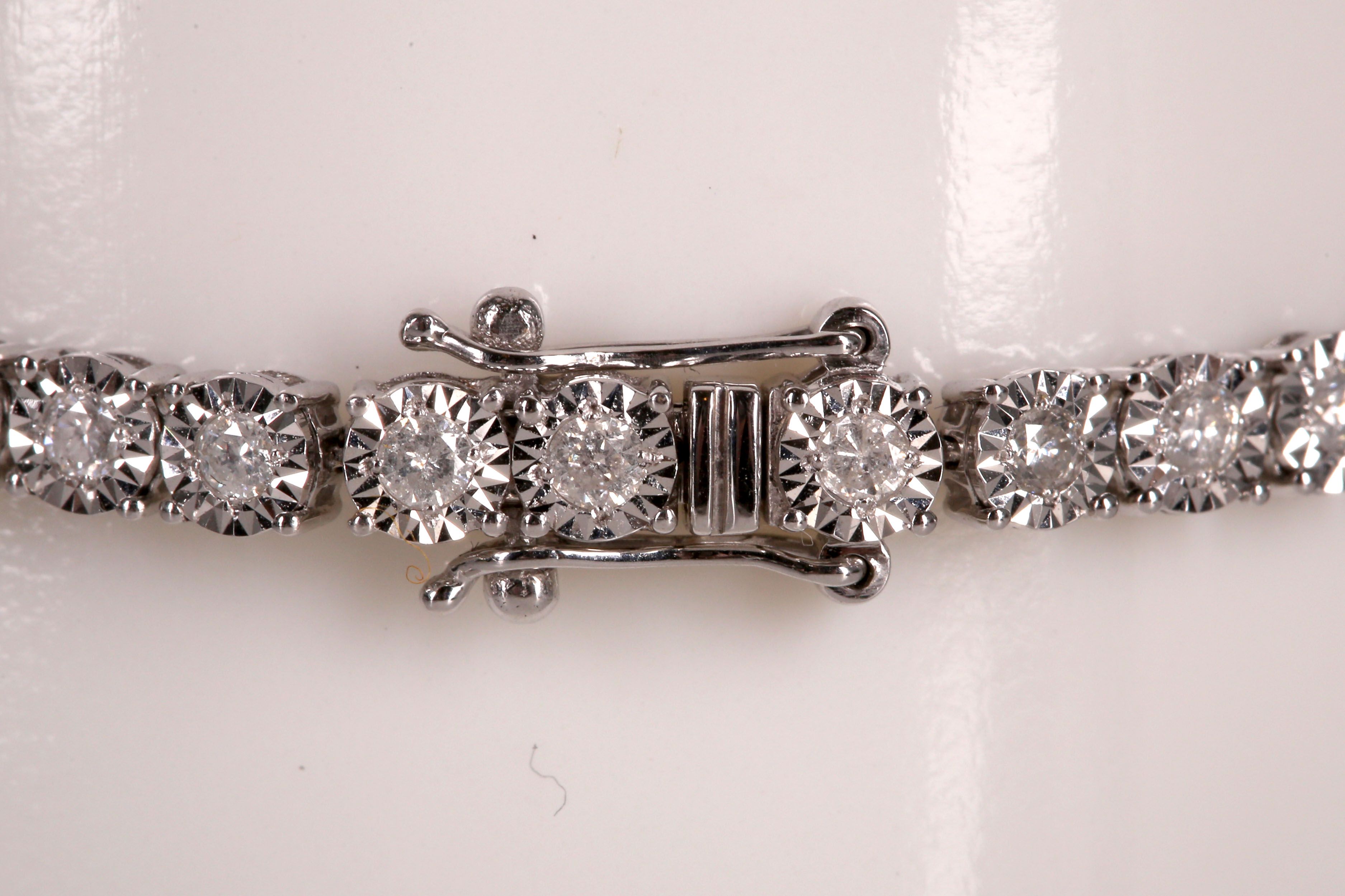 An 18ct white gold and diamond tennis bracelet, 2ct total. - Image 2 of 2