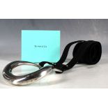 A Tiffany & Co, Elsa Peretti equestrian belt, with .925 silver buckle and black suede belt.