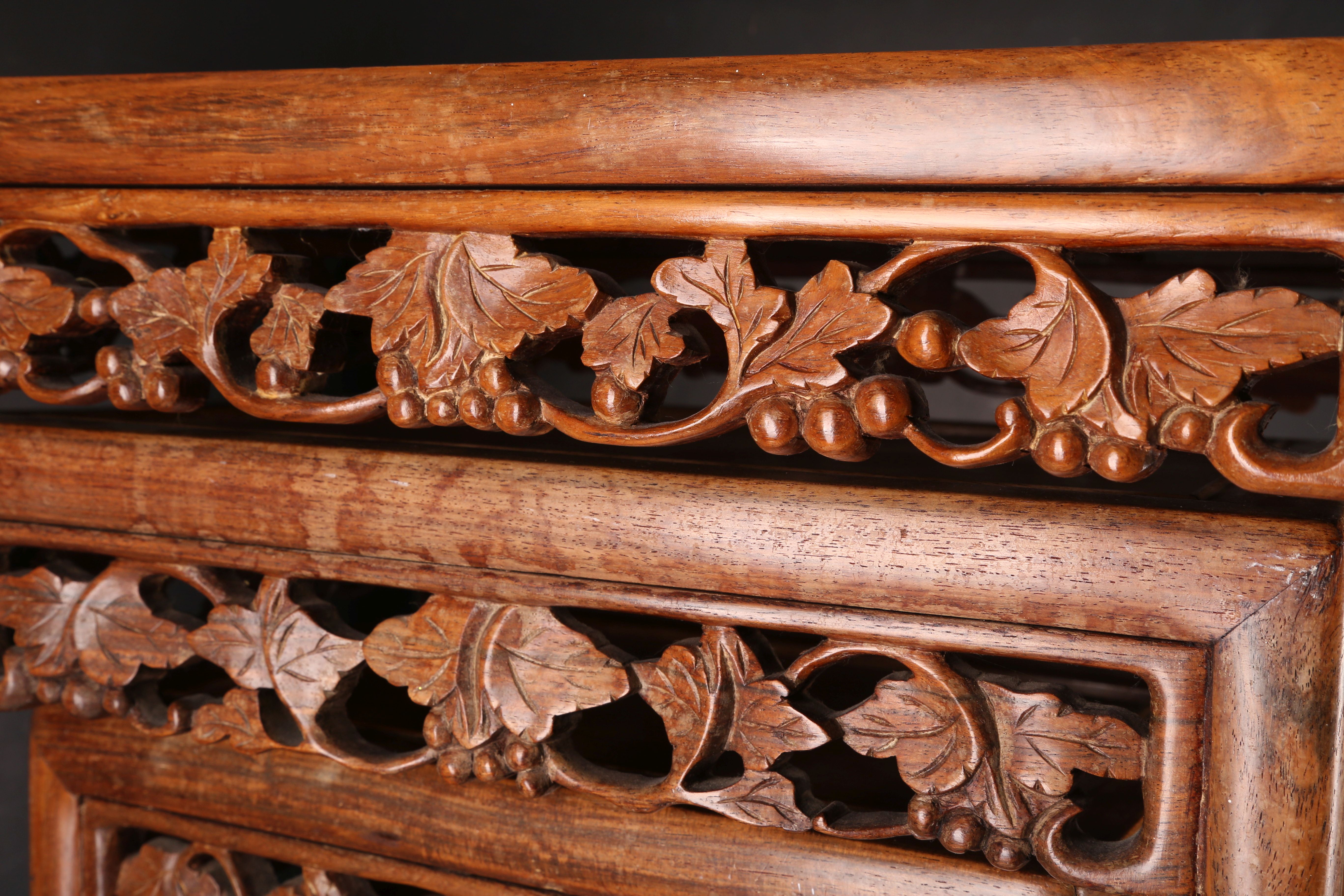 A nest of four Chinese hardwood tables, having carved aprons and inset tops. (4) - Image 3 of 3