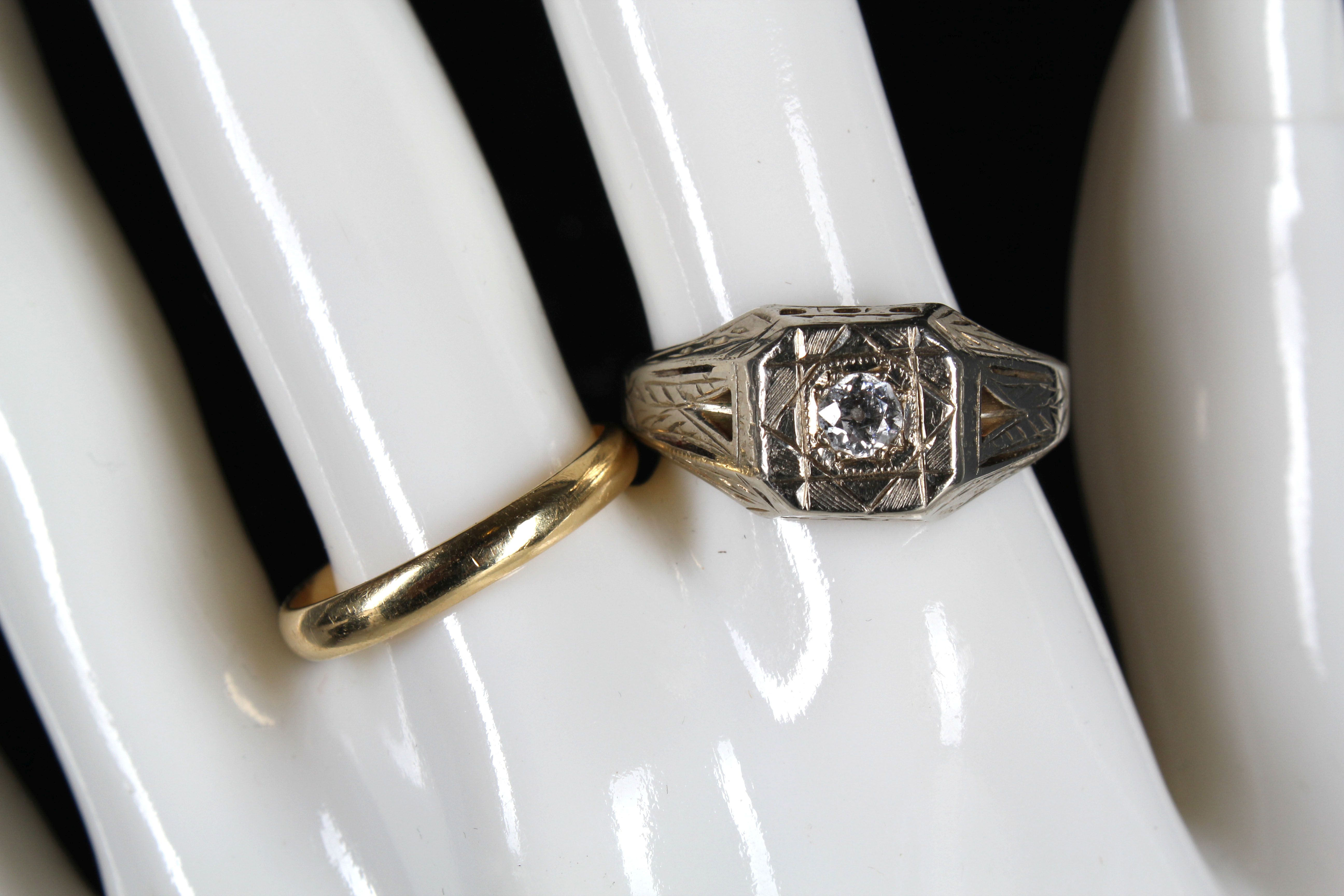 A gents 14k white gold and diamond set dress ring, together with an 18ct gold wedding band. (2)