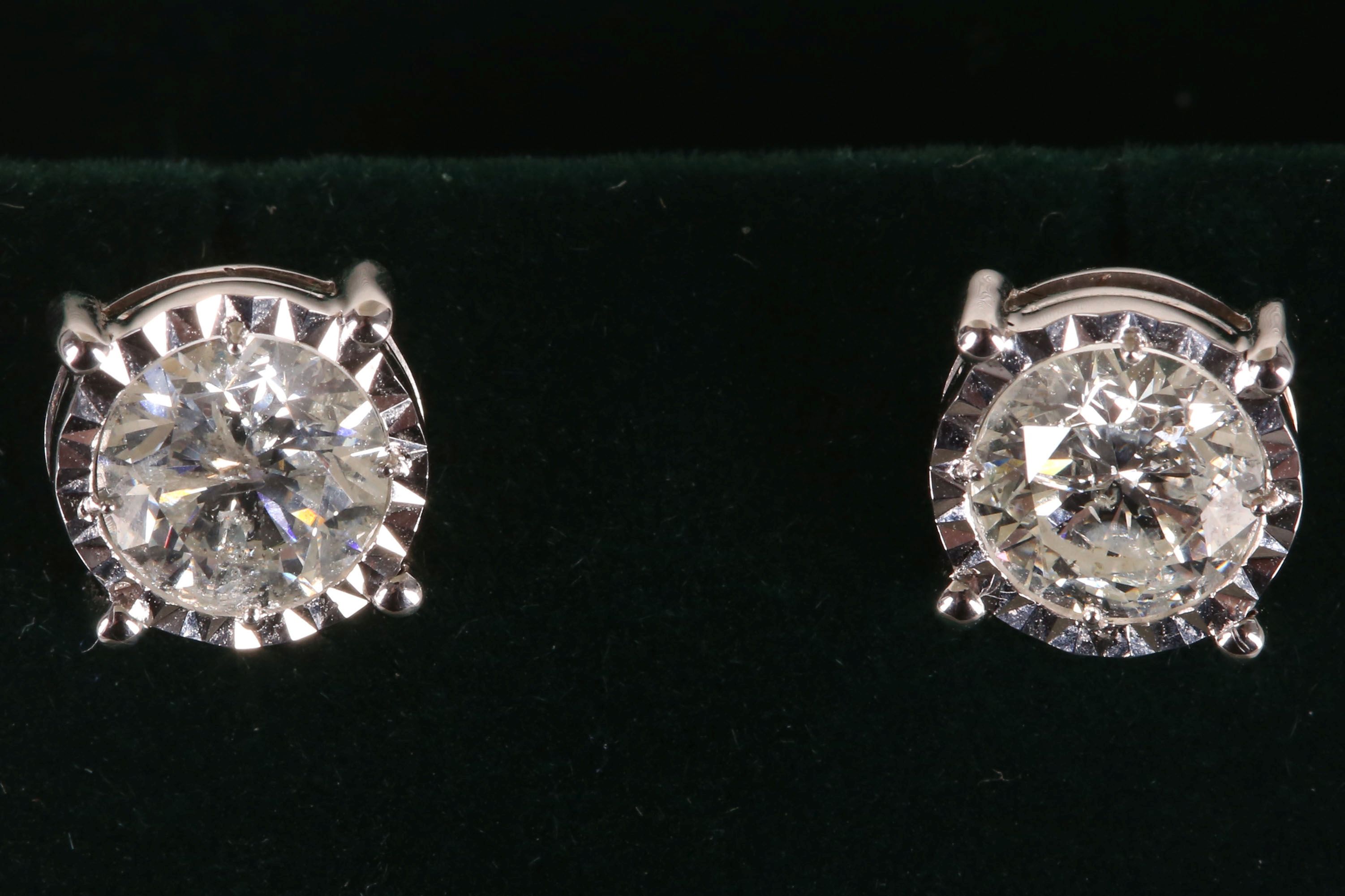 A pair of 18ct white gold and diamond screw back diamond studs, 2.13ct.