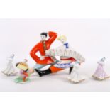 Group of five Soviet porcelain dancing figurines; three dancing girls, a boy playing garmoshka,