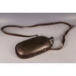 An early 20th Century car / picnic flask, metal top and body, repaired leather strap, dents and