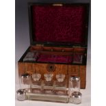 A late Victorian walnut dome top travelling ladies vanity box, having Tonbridge banding and