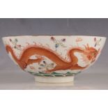 A Chinese serving bowl, red bats and symbol to inner, green waves to outer with red and green open