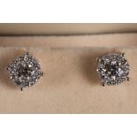 A pair of 18ct white gold and diamond multi-cluster ear studs with screw backs.