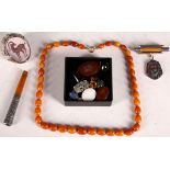 A Roman intaglio, loose crystals, amber necklace, Persian intaglio ring seal in white metal mount,