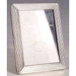 A boxed, modern London hallmarked silver photograph frame, retailed by Daniels Jewellers of