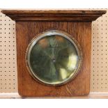 An Aitchison oak wall mounted barometer, with engraved brass dial (dial 21cm dia).