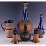 A large Royal Doulton Slaters bottle form vase, a smaller vase of bottle form, a Slaters carafe, a
