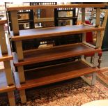 A set of four shop display oak veneered coffee tables / gallery seats, supported on metal