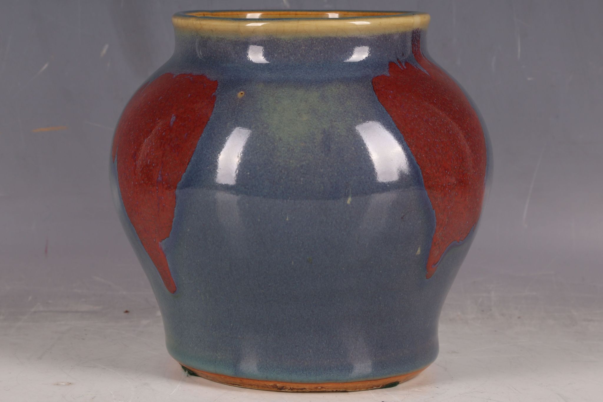 A Chinese flambé glazed wide shouldered vase, with red steaks in the glaze, 17cm H. - Image 2 of 3