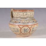 An Iranian single-handled vase, decorated with rings of calligraphic inscriptions and floral