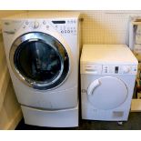 A Whirlpool silent motion, 6-sense washing machine, along with a Bosch Maxx 7 sensitive tumble