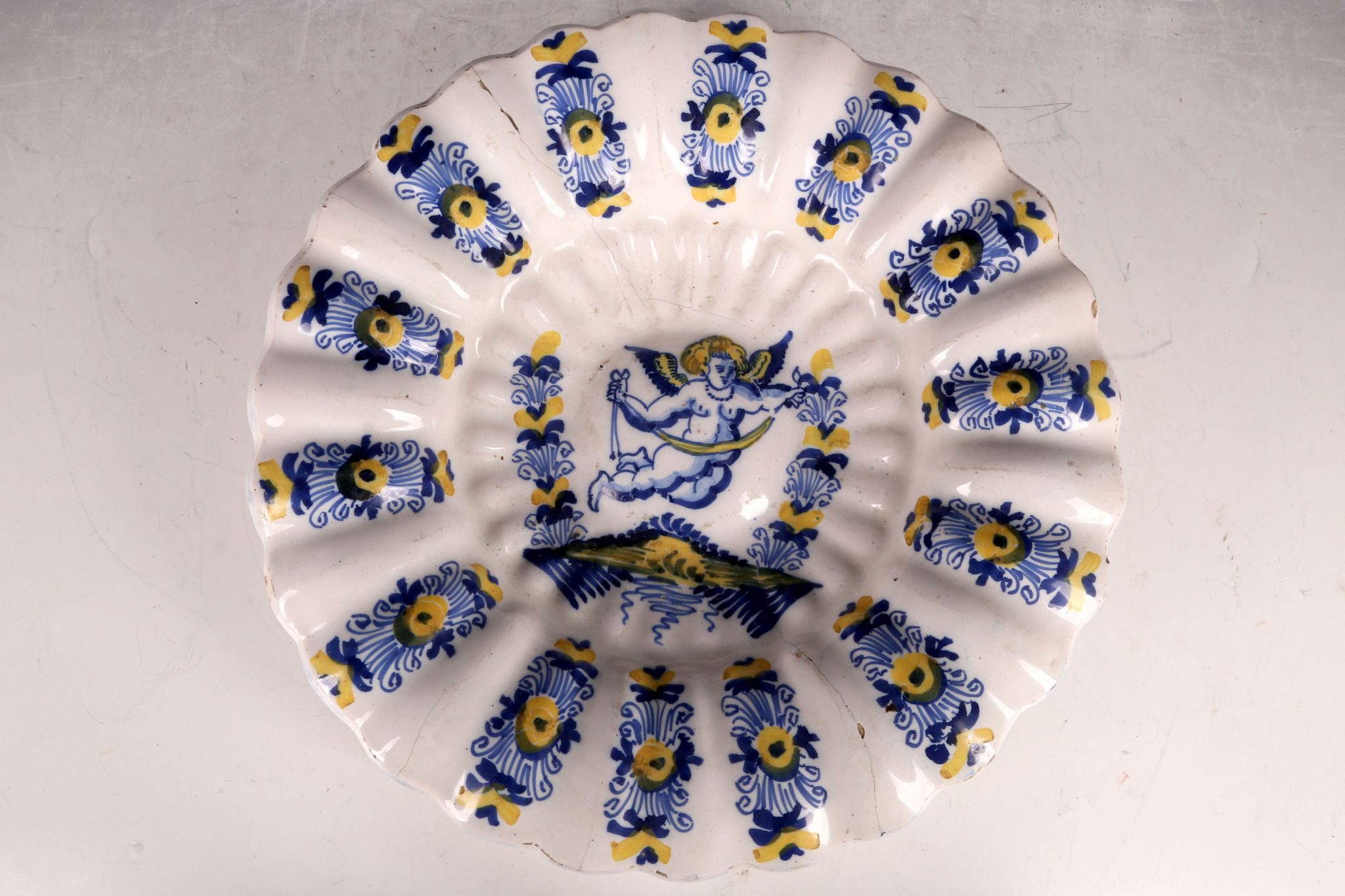 A Delft blue and yellow dash charger, of lobed and dished form, 34cm dia.