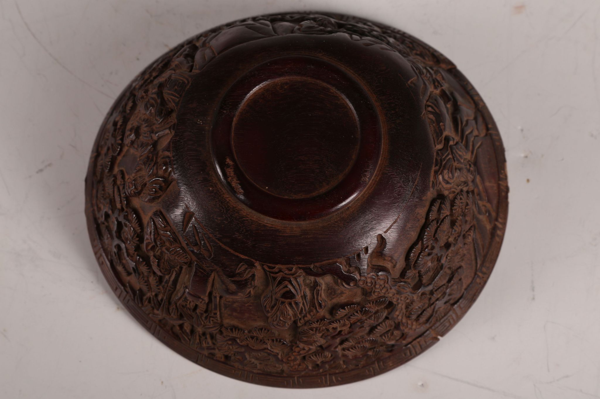 A Chinese ox horn bowl, carving to flank of the eight immortals in garden / forest scene, 12.5cm - Image 3 of 3