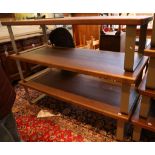 A set of three shop display oak veneered coffee tables / gallery seats, supported on metal supports,