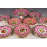 Twelve antique ceramic cake plates, decorated with fruits, pink and gilt frieze on white ground, and