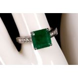 An 18ct white gold, emerald and diamond set ring (em. 3.40ct, dia. 0.47ct).