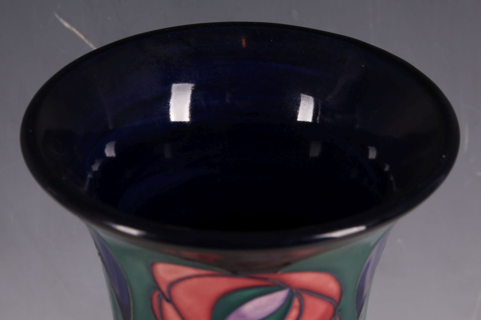 A Moorcroft tube-line vase, everted rim, Mackintosh rose pattern, marks for Ann Bishop, 25.9cm H. - Image 5 of 6