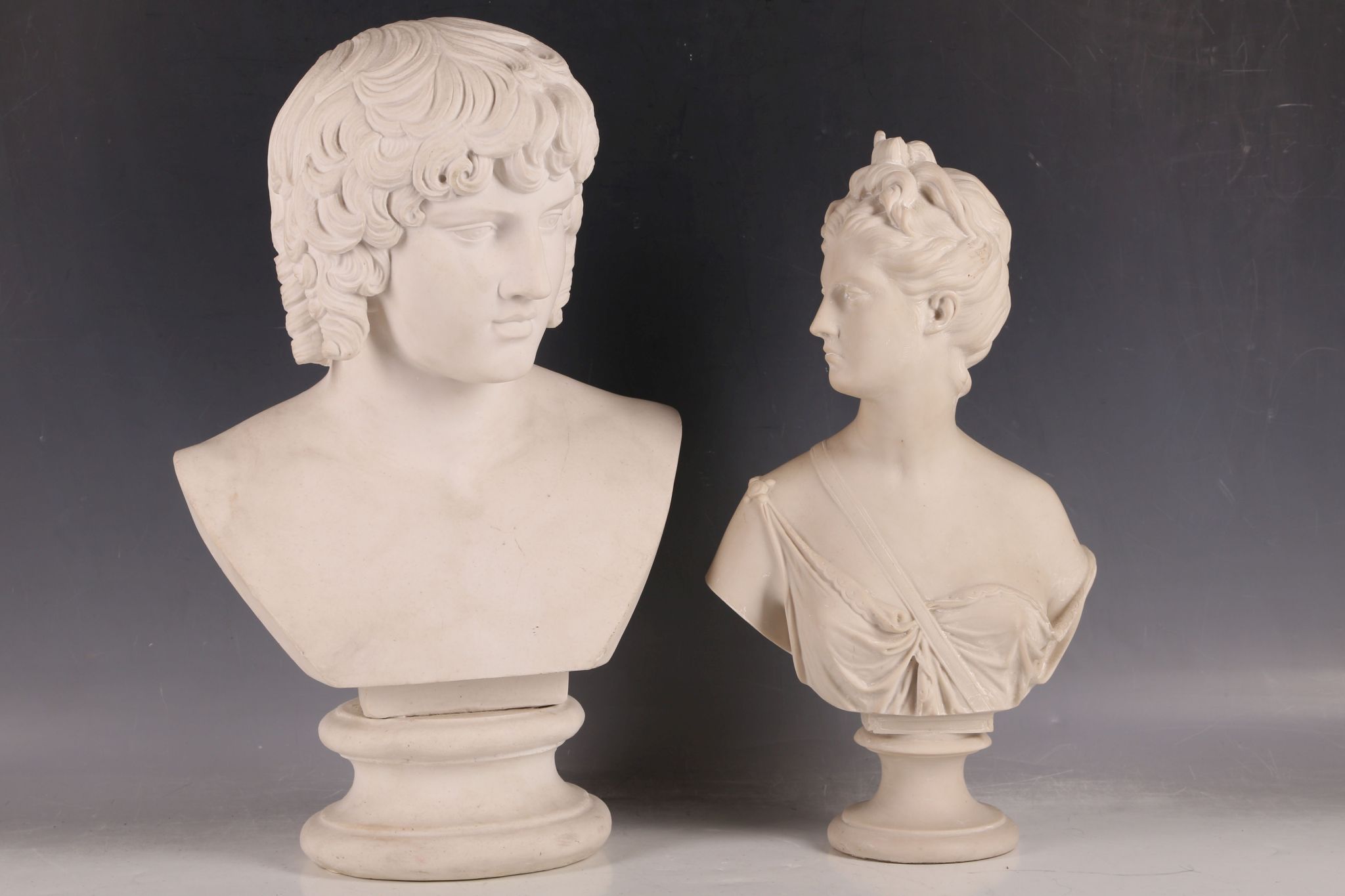 A 20th Century bust of a young Roman Emperor, possibly Antinous. Together with another bust of