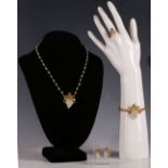 A suite of 22ct gold, sapphire and pearl set jewellery, comprising hinged bangle, necklace, earrings