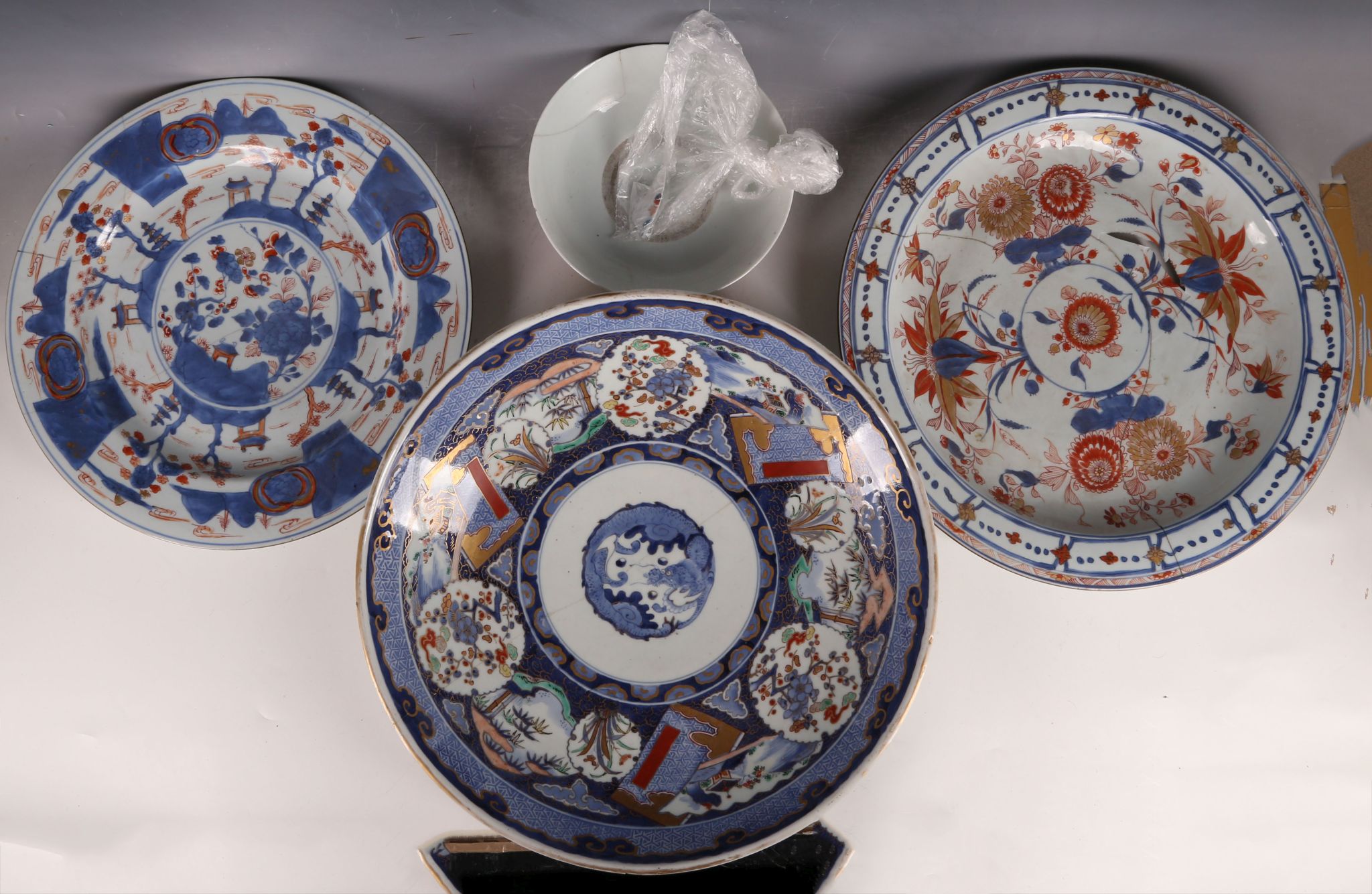 Three large Imari decorated plates, one with Qianlong mark, 36-40cm dia. Together with a bowl,
