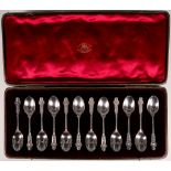 A fine cased set of twelve early Edwardian hallmarked silver spoons, embossed with scrolling