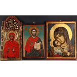 Three late 19th / early 20th Century icons, one representing Madonna and Child, measuring 36 x 28cm,